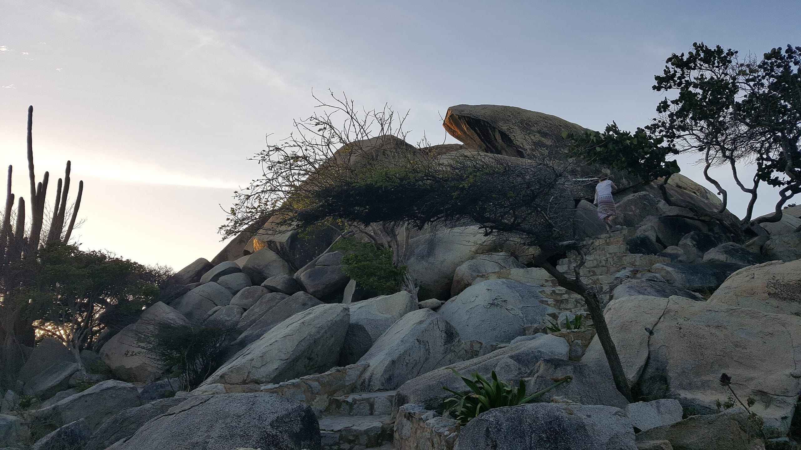 Rounded boulders piled above the scrub at Casibari with cactus standing between them